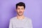 Portrait of nice attractive puzzled guy grimacing dont know clueless isolated over bright violet purple color background