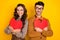 Portrait of nice cheerful friends friendship trendy couple embracing heart self concept isolated on bright yellow color