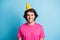 Portrait of nice cheerful guy wearing yellow celebratory cap corporate event isolated over bright blue color background