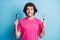 Portrait of nice funny cheerful guy holding in hands fork spoon preparing wait lunch isolated over bright blue color