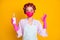 Portrait of nice healthy housemaid wearing textile mask using soap showing ok-sign isolated bright yellow color