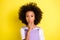 Portrait of nice pretty wavy-haired girl showing shh sign taboo isolated over bright yellow color background