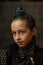 Portrait of nine year old girl. Teenager with blue strands on her hair. A series of photos of a girl of 8 or 9 years old
