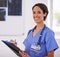 Portrait, nurse and happy woman writing on clipboard in hospital for healthcare, wellness and xray. Face, smile and