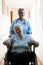 Portrait of nurse pushing patient sitting in wheelchair