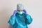 Portrait of nurse wearing coronavirus protections with hygienic face surgical medical mask and gown