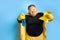 Portrait of obese man with detergents isolated