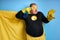 Portrait of obese man with detergents isolated