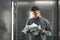 Portrait of a office worker examining the documents in the elevator.Close up photo of employer man in the lift reading the