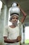 Portrait old Bangladeshi man lugging water jug