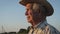 Portrait Of Old Caucasian Man With Hat On Outdoor Turns His Head Towards Sunset