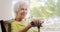 Portrait Old Lady Sitting On Rocking Chair Holding Stick