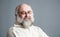 Portrait of Old Man with Beard. Gray Background.