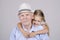 Portrait of an old man eighty years old with a four-year granddaughter