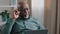 Portrait old senior mature African pensive busy man worker businessman with laptop working thinking searching problem