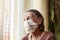 Portrait of old woman wearing surgical mask