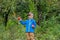 Portrait of one cute boy in a hat in the garden with a red apple, emotions, happiness, food. Autumn harvest of apples