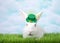 Portrait of one white albino bunny rabbit wearing St Patrick`s Day hat