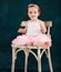 Portrait of the one year old baby wearing ballet suit indoor
