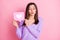 Portrait of optimistic girl hold like blow kiss wear lilac sweater isolated on pink color background