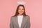 Portrait of optimistic joyful businesswoman in suit jacket with angelic beautiful appearance and halo over her head