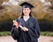 Portrait, outdoor and girl with graduation, university and event for achievement, success or excited. Award, person or