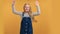Portrait overjoyed female kid jumping with raising hands rejoicing happy childhood posing isolated