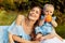 Portrait of overjoyed smiling mother with adorable daughter