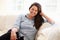 Portrait Of Overweight Woman Sitting On Sofa