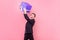 Portrait of overwhelmed happy man in suit and with stylish haircut screaming for joy. studio shot isolated on pink background