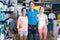 portrait of parents with daughter teenager shopping in drug store