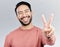 Portrait, peace sign and laughing Asian man in studio isolated on a gray background. Face, v emoji and happy, smiling or