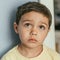 Portrait of pensive, adorable brunette boy