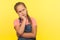 Portrait of pensive thoughtful little girl with braid in denim overalls leaning on hand, pondering answer