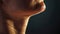 A portrait of a persons neck the s appearing prominently with each breath representing the vitality and resilience of