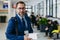 Portrait of pharmaceutical sales representative in medical building holding box with drugs samples.