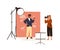 Portrait photography backstage. Female photographer taking photo or shooting African American man posing in studio with