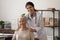 Portrait of physician and senior woman patient looking at camera