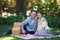 Portrait, picnic and couple with love, basket and happiness with romance and Valentines day with marriage. Date, man and