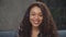 Portrait of playful black woman with curly hair