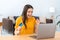 Portrait of pleasantly excited woman shopping online using laptop