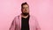 Portrait of a plump man on a pink background, black friday, sale