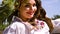 Portrait of plus size girl in traditional Slavic costume posing with watermelons