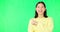 Portrait, pointing and space with a woman on a green screen background in studio for marketing or product placement