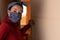 Portrait of positive black brazilian woman with face mask