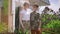 Portrait of positive Caucasian military woman and teenage boy gesturing thumbs up smiling looking at camera. Happy