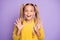 Portrait of positive cheerful kid hear wonderful news about her birthday newyear present scream wow omg raise hands wear