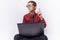 Portrait of a positive and emotional schoolboy posing with a laptop, came up with a brilliant idea, white background, glasses, red