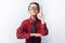 Portrait of a positive and emotional schoolboy, pulls his hand to the Board, white background, glasses, red shirt, business theme,