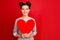 Portrait of positive girl happy girlfriend have 14-february date receive hold big red paper card heart wear casual style